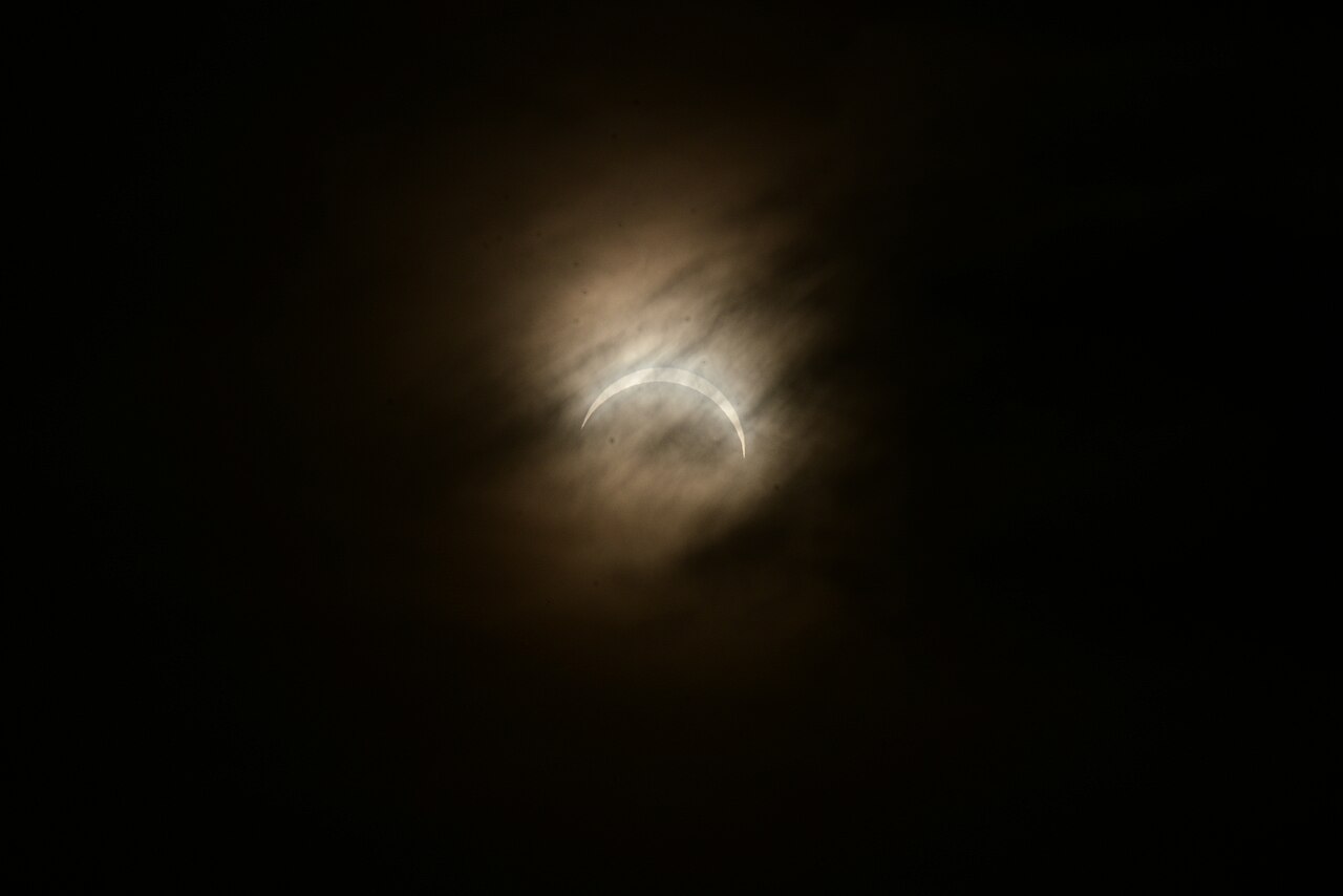 Partial solar eclipse seen through clouds over Drypool in Kingston upon Hull on 12 August 2026